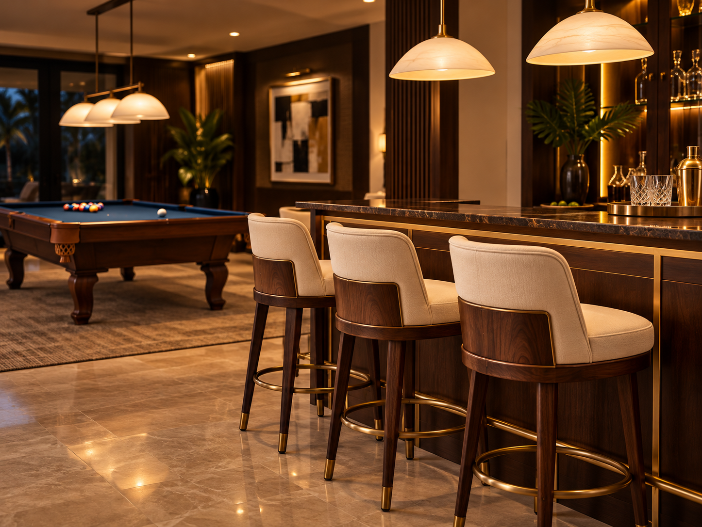 Cream upholstered walnut bar stools at a home bar with a blue-cloth pool table in the background.