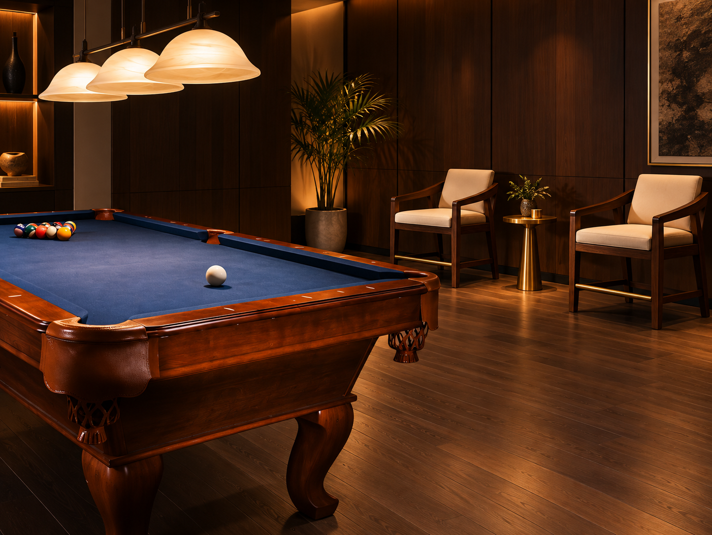 Cream upholstered spectator chairs arranged beside a blue-cloth pool table in a walnut-paneled game room.