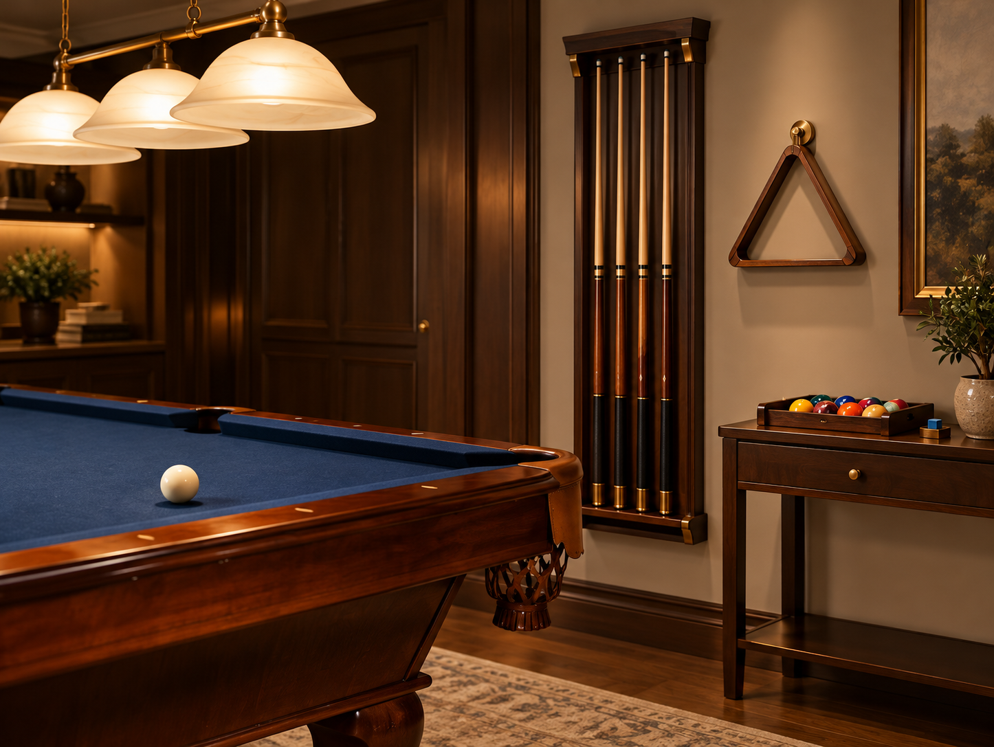 Wall-mounted cue rack, triangle rack, and ball storage beside a blue-cloth pool table.